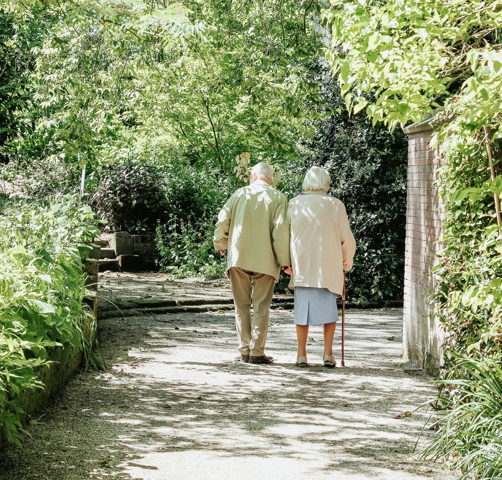 man and woman walking on road during daytime